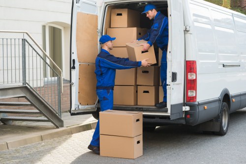Removal team loading boxes and furniture for a Catford move