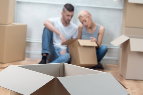 Team handling boxes and furniture in a flat move